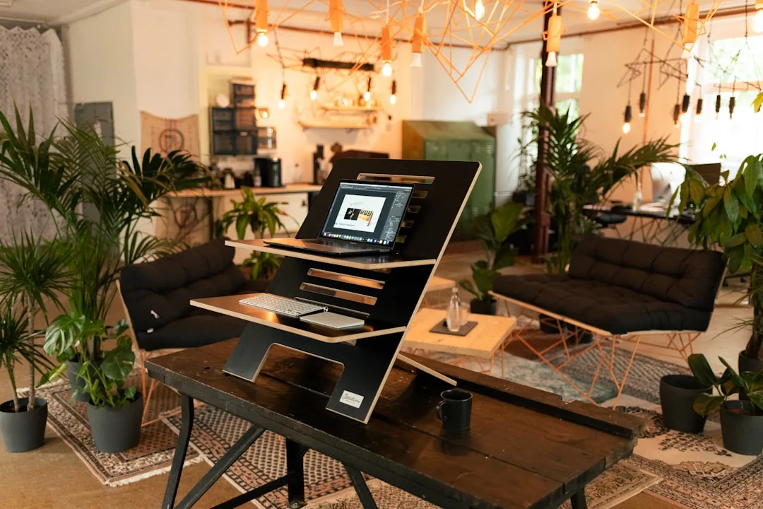 creative workspace with laptop and sketches