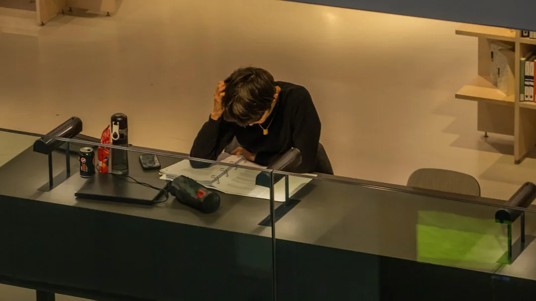 manager taking notes in meeting