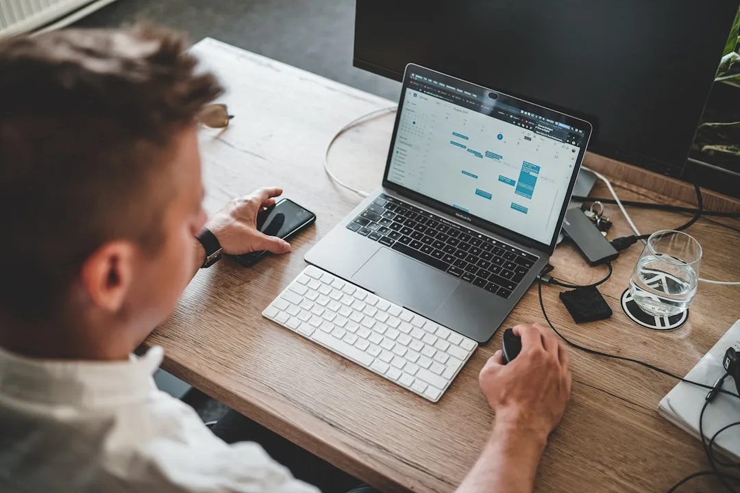 person typing on laptop