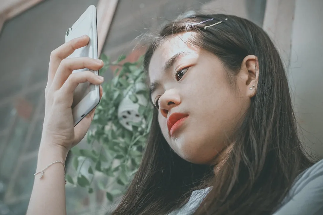 person using phone to learn