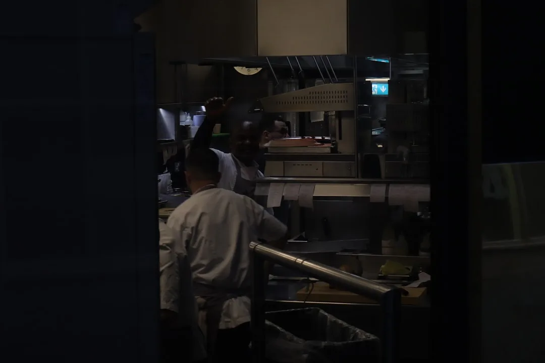 young chef taking notes in kitchen