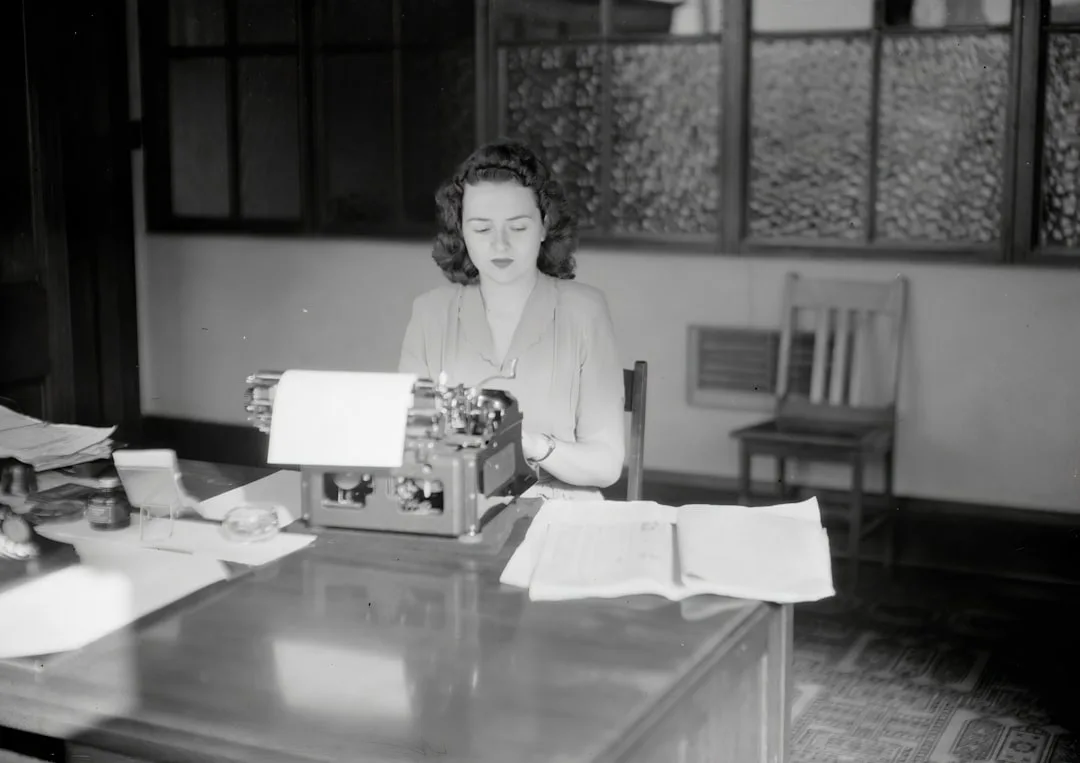 woman applying serum at desk